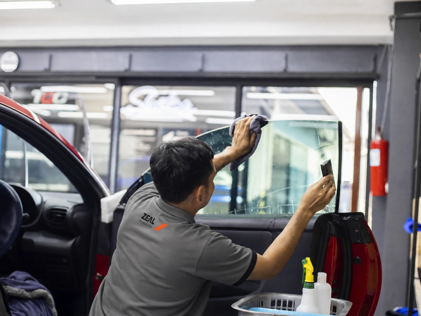 ZEAL window-film installation process at 27Speed, image 2